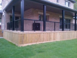 Backyard Porch With Black Railings And Posts