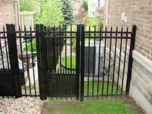 Black Aluminum Gate and Fence Leading Into Backyard