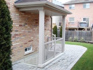 White Stair Railings and Posts Leading Down To Outdoor Basement Access